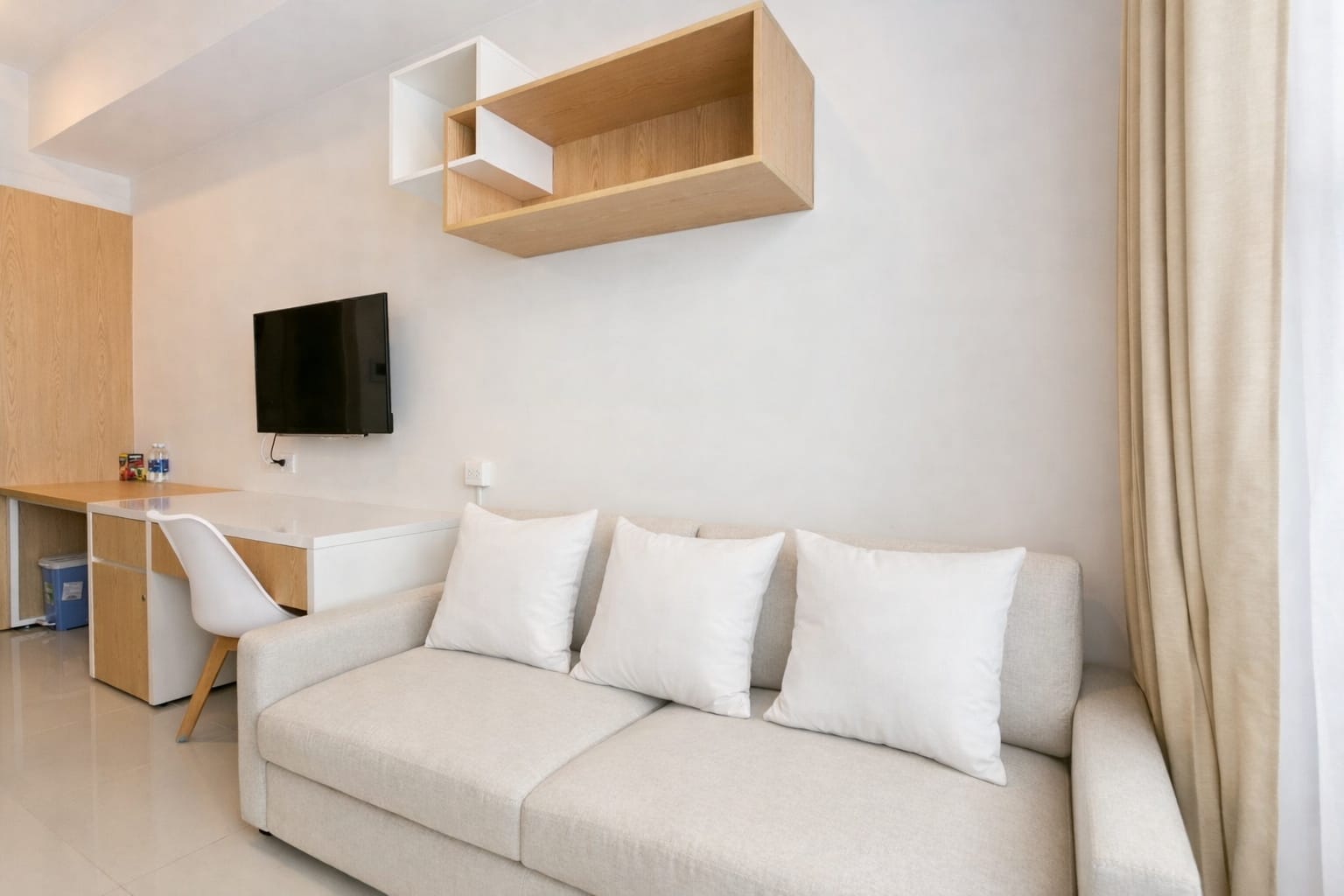 Living area in studio apartment at Saigon Apartment